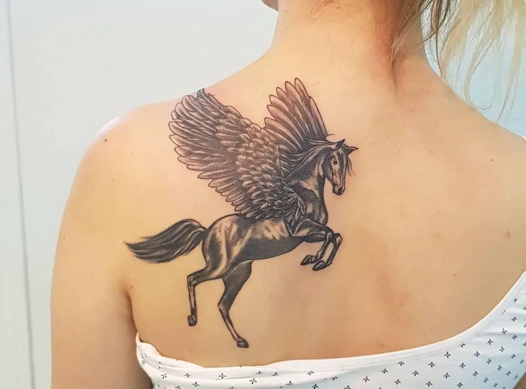 pegasus tattoo on a woman's back