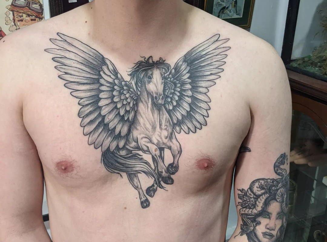 Pegasus tattoo on a man's chest