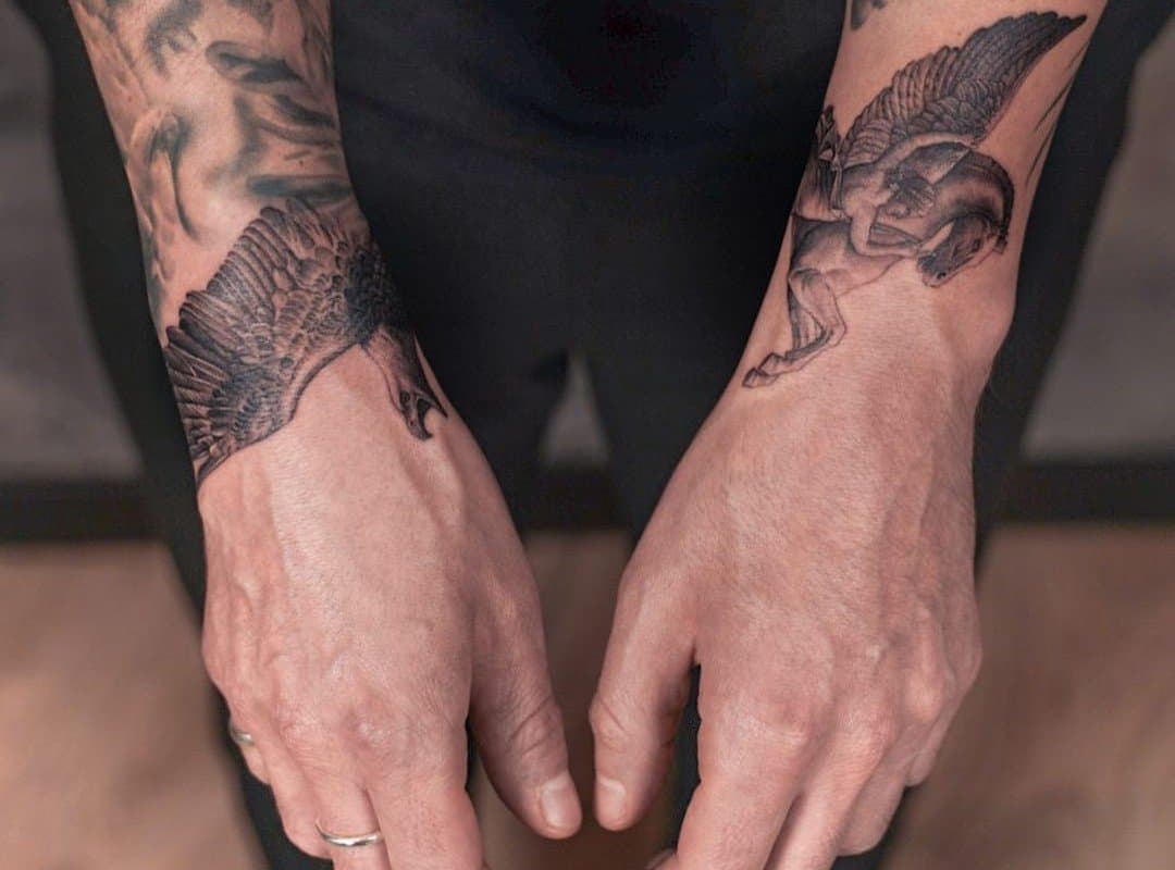 Pegasus tattoo on wrists