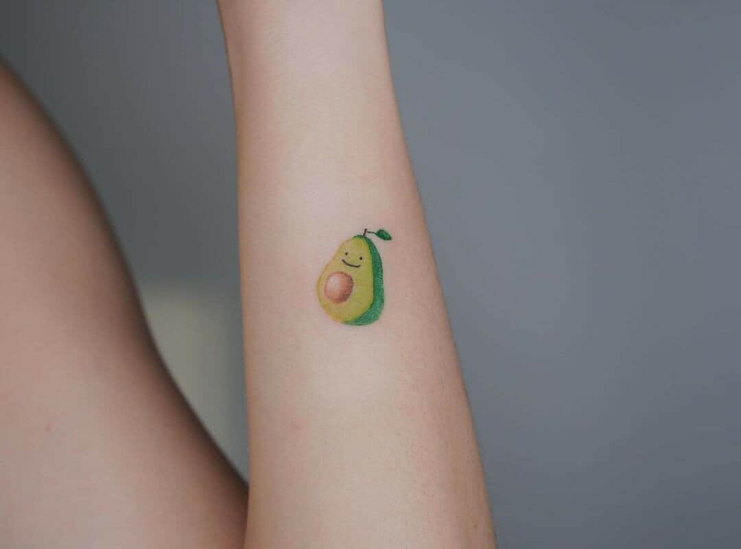 smiling avocado tattoo on your arm