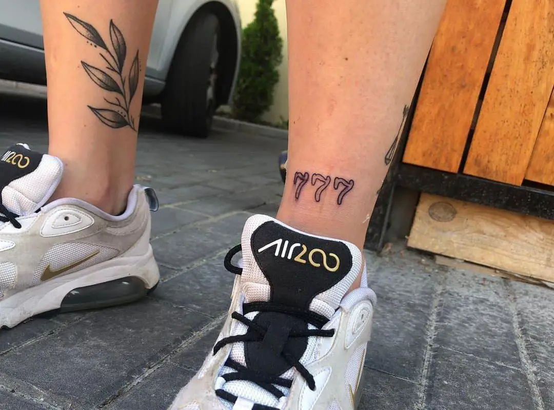three sevens tattoo on the leg