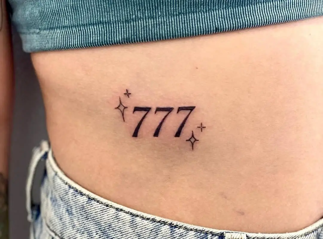 three sevens tattooed