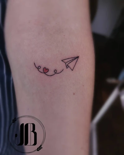 uncovering-the-meaning-behind-a-paper-airplane-tattoo-what-does-it