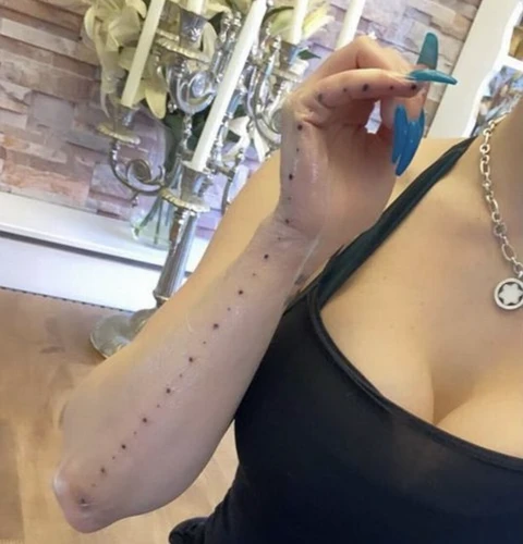 Measuring A Tattoo With A Ruler